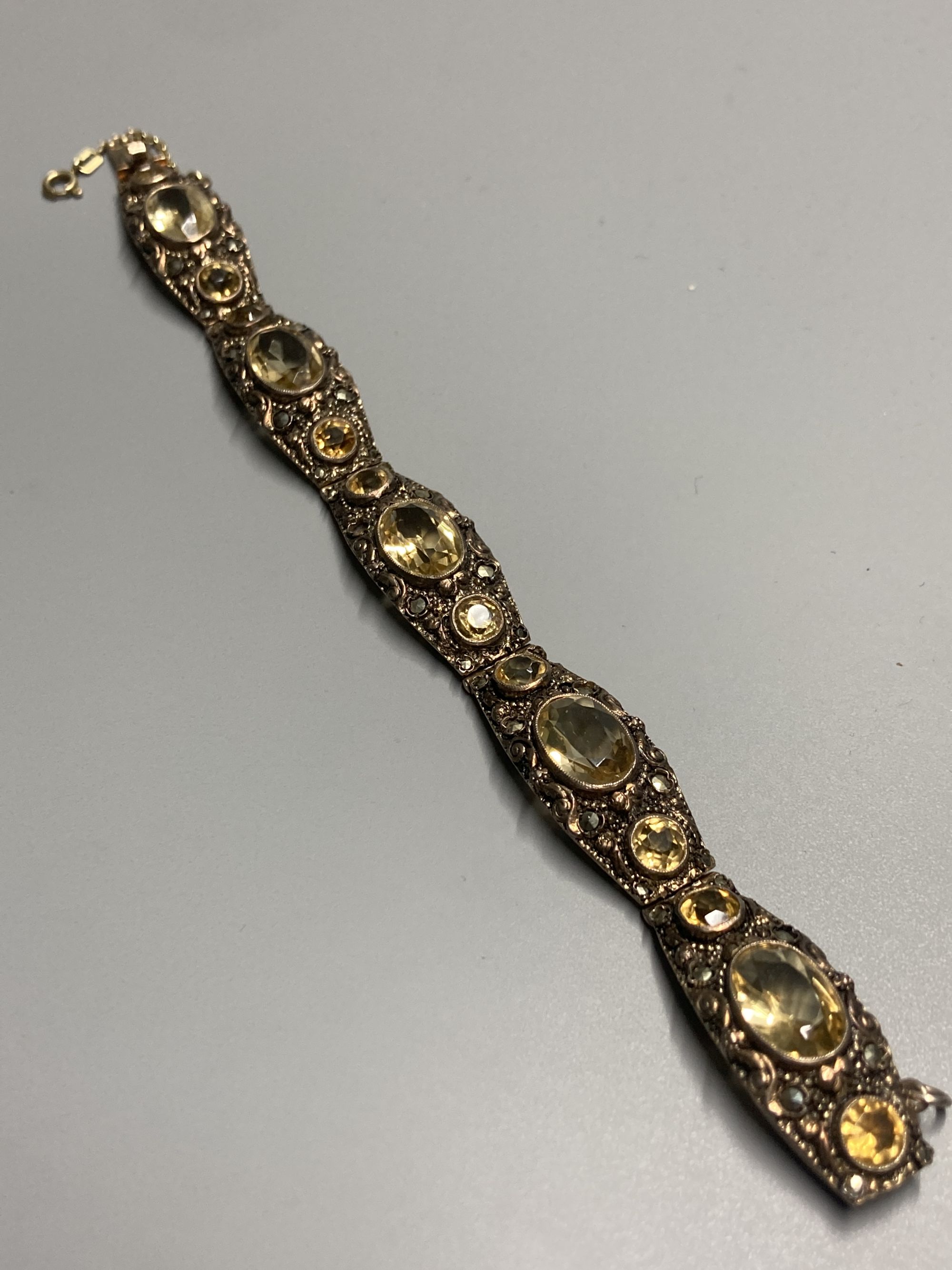 A continental 935 gilt metal and oval and round cut citrine and paste? set bracelet, approx. 16.5cm, gross 28 grams.